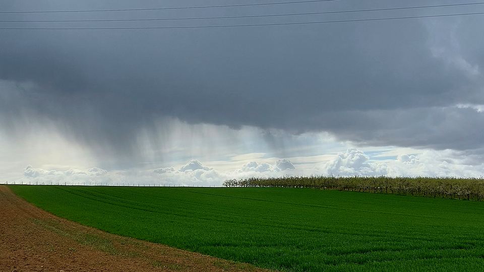 Rain sweeping over the countryside